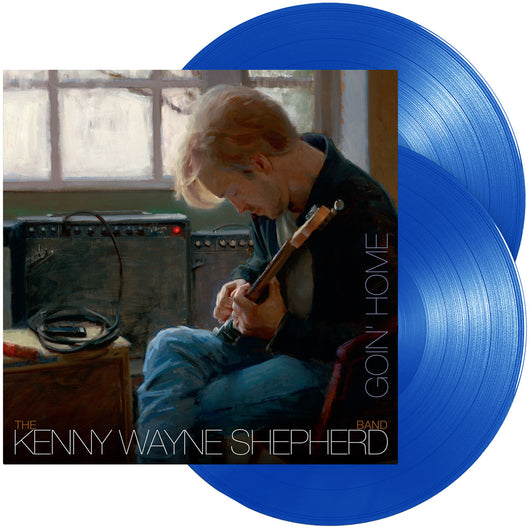 Blue vinyl record album featuring a musician playing guitar on the cover.